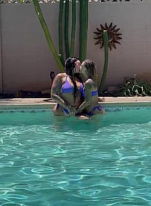 Playing with her tits in our pool'